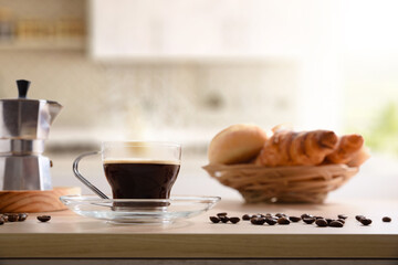 Coffee for breakfast on kitchen bench with pastries in kitchen