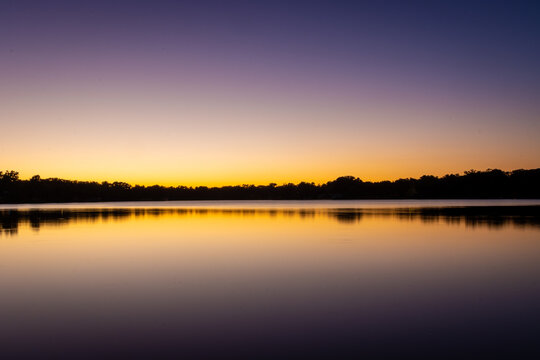 Purple and gold sunset over lake © Ajax9