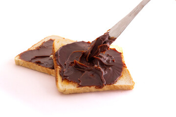 choco spread with bread on white background