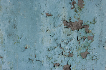 Peeling paint on the wall. Old concrete wall with cracked flaking paint. Weathered rough painted...