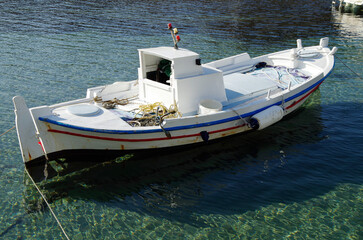 Picturesque view over port town with blue domes, roofs and churches in travel and honeymoon...