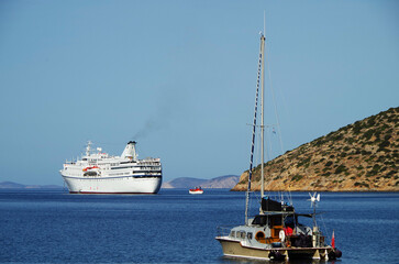 Picturesque view over port town with blue domes, roofs and churches in travel and honeymoon...