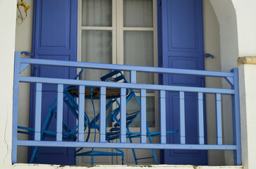 Picturesque view over port town with blue domes, roofs and churches in travel and honeymoon...