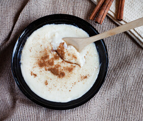 Traditional South African Melkkos or milk food, a creamy dessert type dish served with cinnamon sugar mix

