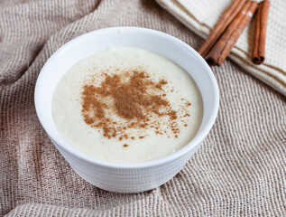 Traditional South African Melkkos or milk food, a creamy dessert type dish served with cinnamon sugar mix

