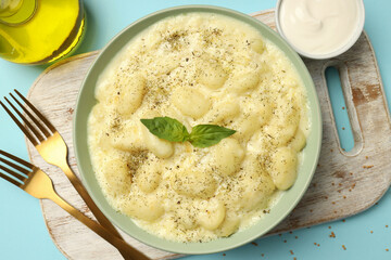 Concept of tasty food with potato gnocchi, top view