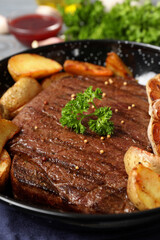 Concept of tasty food with beef steak, close up
