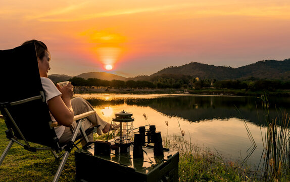 Asian woman travel and camping alone at natural park in Thailand. Recreation and journey outdoor activity lifestyle.