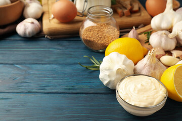 Concept of cooking garlic sauce on wooden background