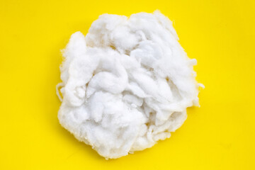 Polyester stable fiber on yellow  background.