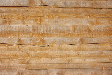 Beautiful Wooden background. The wall of the house is made of beams. Template for the inscription. Layout for the design. Photo close-up.