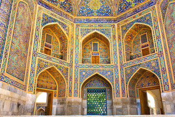 Beautiful facade of the Registan mosque building in Uzbekistan tourist city of Samarkand ancient...
