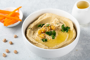Hummus with carrot. Healthy snack. Vegetarian food. Chickpea hummus.