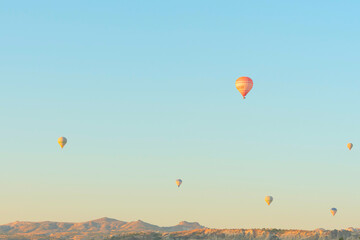 Hot air balloons in the sky during sunrise. Travel, dreams come true concept