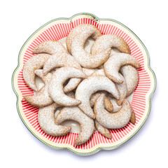 Traditional German or Austrian Vanillekipferl vanilla kipferl cookies on decorated ceramic plate