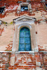 Fototapeta na wymiar Fragment of an old noble building with a window