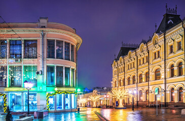 Fototapeta na wymiar Ancient buildings on the Kuznetsky bridge in Moscow in the light of night lights