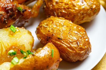 tasty and healthy food, lunch in rural style - fried chicken meat and unpeeled roasted potatoes, cooked food