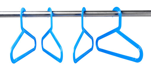Metal rack with clothes hangers on white background