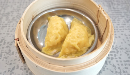 Streamed dumplings in bamboo container