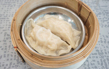 Streamed dumplings in bamboo container