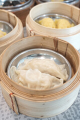 Streamed dumplings in bamboo container