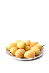 Fototapeta na wymiar Plango fruit or Marian plum in white dish isolated on white background