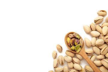 Pile of Pistachios on wooden spoon, pistachios isolated on white background.
