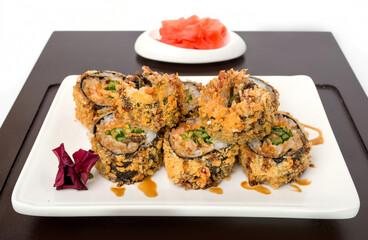 Sushi rolls Japanese delicacies. Japanese traditional rice and fish dishes. Beautiful serving food on a light background with copy space. A set of delicious goodies.