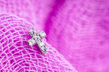 Gold cross. Macro shot. Selective focus.