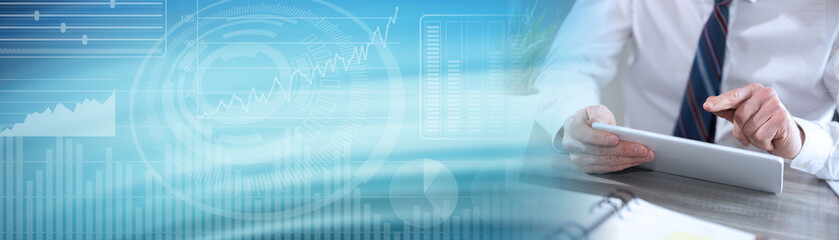 Obraz premium Businessman using digital tablet; panoramic banner