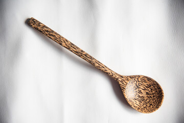 Close up spoon wood on white background.