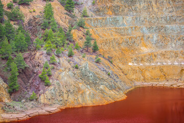 The Amazing Unusual Red Bloody Lake in the Abandoned Career for the Extraction of Gold and Other Colored Metals, Oxidized by Copper and Iron The Unusual Rare Appearance Lake on Cyprus Island