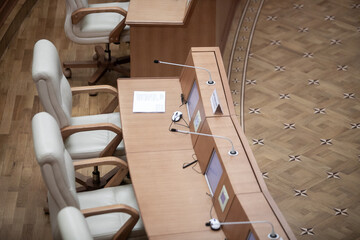 Session of Government. Conference room or seminar meeting room in business event. Academic classroom training course in lecture hall. blurred businessmen talking. modern bright office indoor