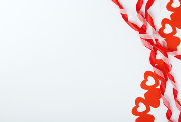 Background wit red ribbon and bright hearts for Valentine day decoration	