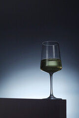 White wine in a transparent glass in low key