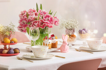 Beautiful table setting with spring flowers for Easter celebration