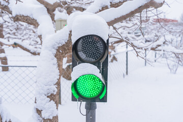 Snowy winter traffic at traffic lights