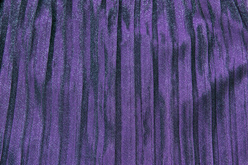 Purple violet sparkle festive pleated shiny background.