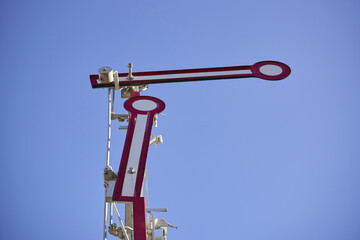 A railway semaphore on background of a sky