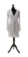 Mannequin with elegant silver dress on white background