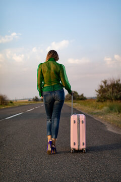 The girl leaves with a suitcase