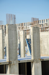 Construction site background. Hoisting cranes and new multi-storey buildings. Industrial...