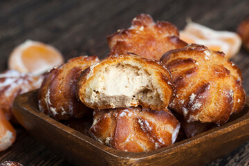 small cakes with custard dough and milk filling