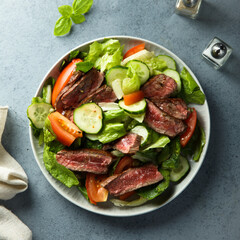 Fresh vegetable salad with beef steak