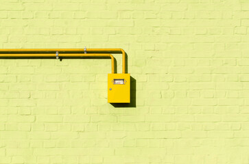 Gas meter with pipes on the wall	