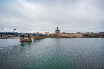 Garonne river and Dome of the 'Hopital de la Grave' at dusk in Toulouse, France