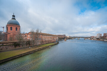 Garonne river and Dome of the 'Hopital de la Grave' at dusk in Toulouse, France