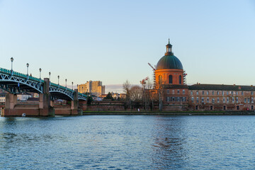 Garonne river and Dome of the 'Hopital de la Grave' at dusk in Toulouse, France