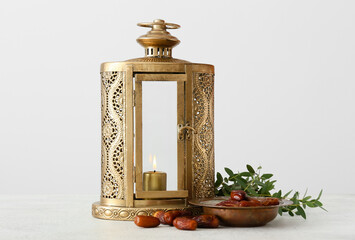 Muslim lantern and dates on light background © Pixel-Shot